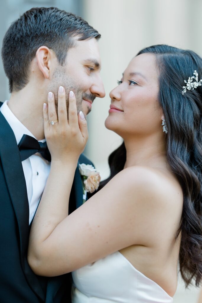 Bride and Groom posing in front of Memorial Hall in Cincinnati for their Cincinnati Music Hall wedding