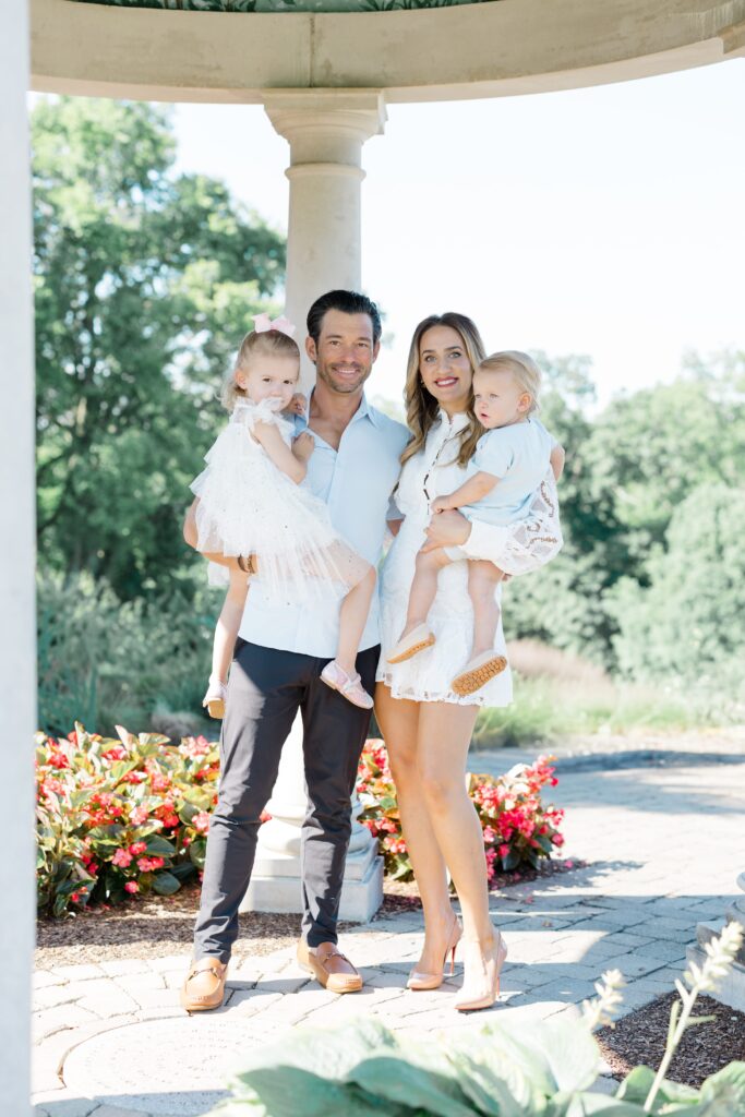 family posing for a photo in cincinnati at glenwood gardens