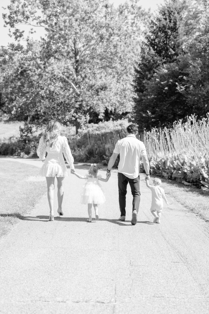 family walking for a photo at glenwood gardens 