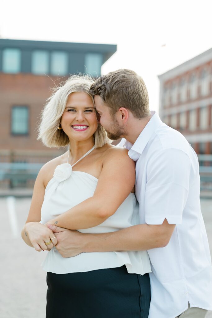 Engaged couple posing for a photo.