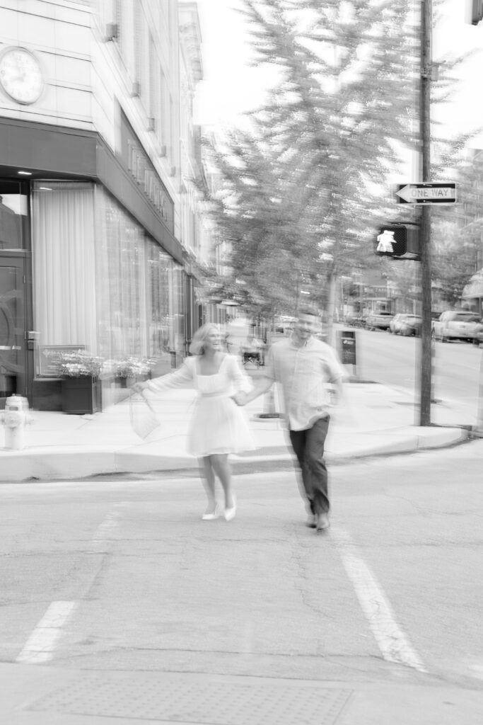 Couple posing for a photo in the street.