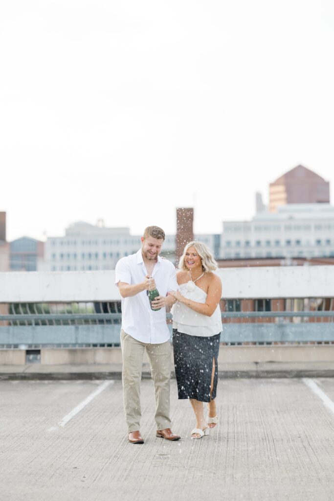 Engaged couple posing for a photo.