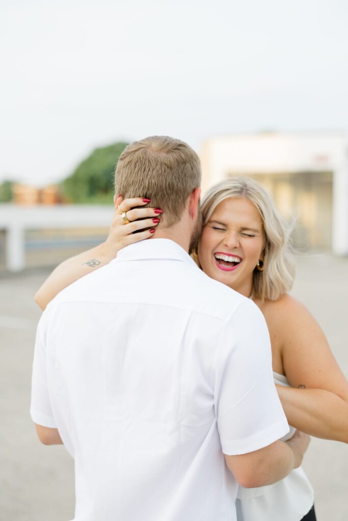 Engaged couple posing for a photo.