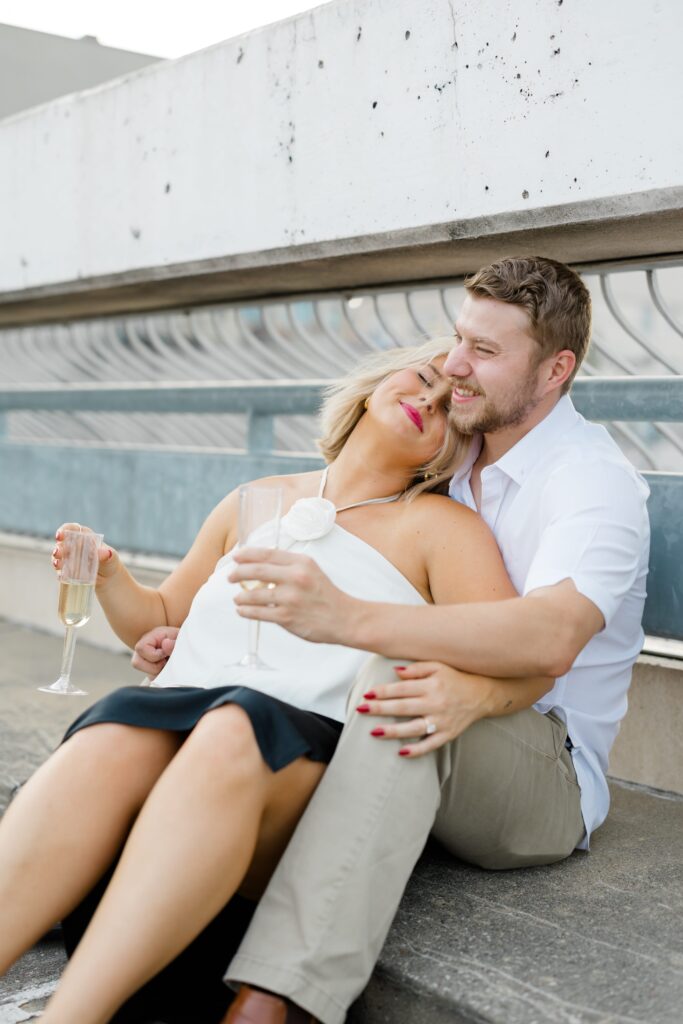 An engaged couple posing for a photo.