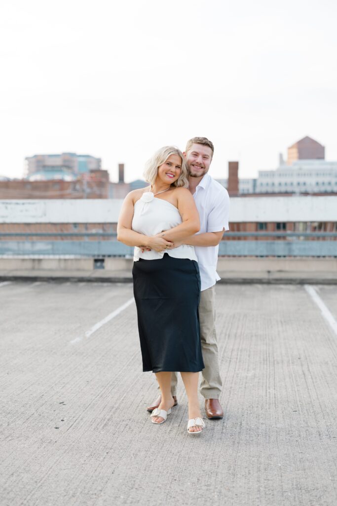 Engaged couple posing for a photo.